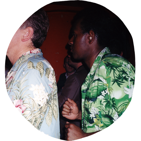 Two dancers wearing Hawaiian shirts