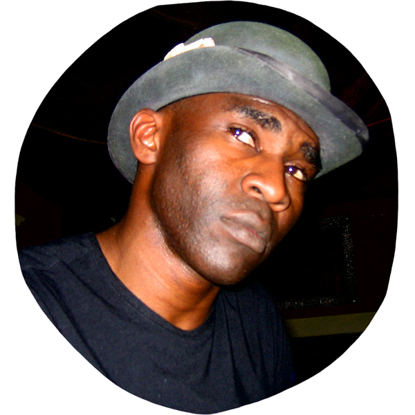 Kola Abidogun wearing trademark bowler hat