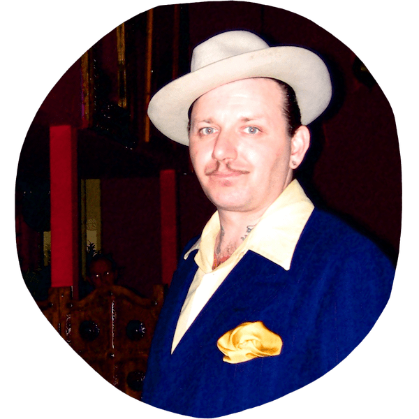 Ronnie King wearing suit and hat